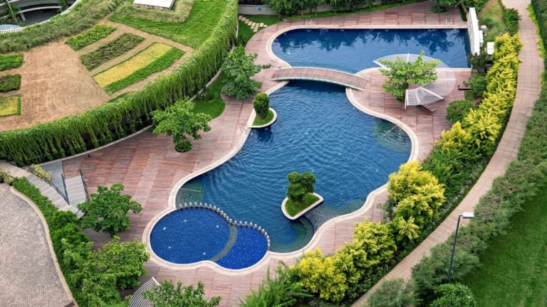 Total Environment - Windmills of Your Mind Apartment & Villa In Bangalore Apartment & Villa In Bangalore- Aerial view of swimming pool & club house