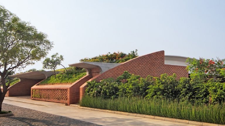 Total Environment - After the Rain - villa in Bangalore Lush greenery contrasts beautifully with the bricks facade