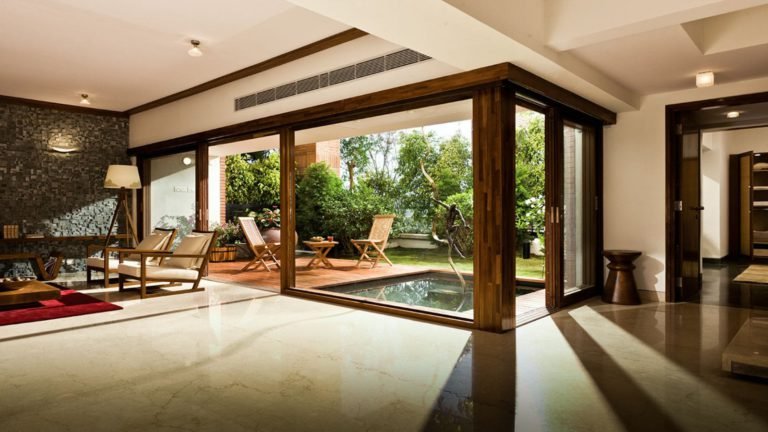 Total Environment - The Magic Faraway Tree Apartment in Bangalore- living room with garden view